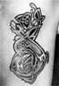 Tattoo by Lal Hardy, original design by Courtney Davis